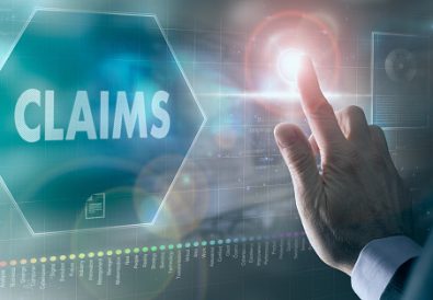 A businessman controlling a futuristic display with a Claims business concept on it.