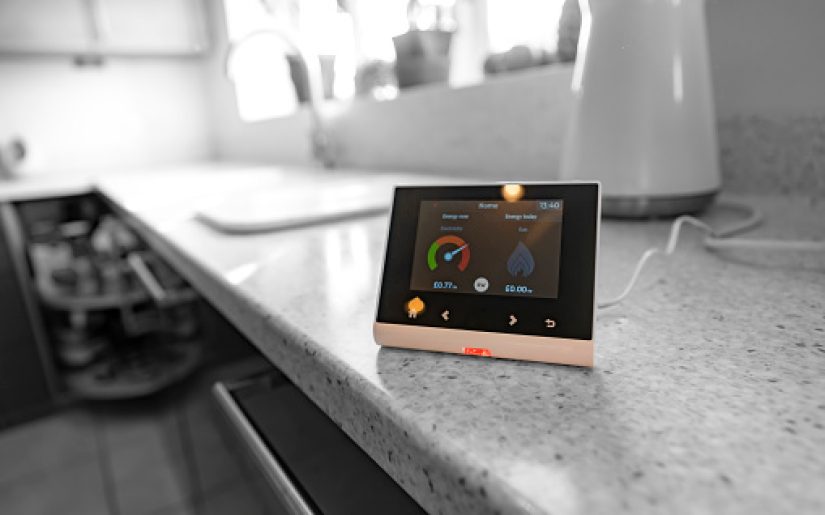 Smart meter fitted in the kitchen of a UK home to enable efficient monitoring of energy usage.