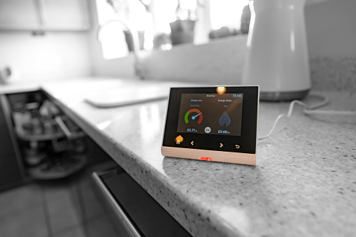 Smart meter fitted in the kitchen of a UK home to enable efficient monitoring of energy usage.