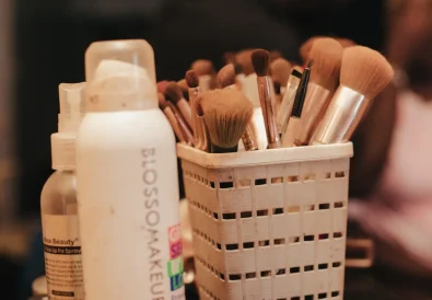 A collection of makeup brushes and beauty products neatly organized in a holder
