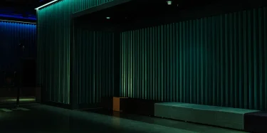 Empty theater space with industrial design and dramatic lighting, ideal for performances