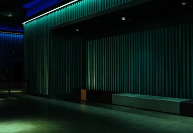 Empty theater space with industrial design and dramatic lighting, ideal for performances