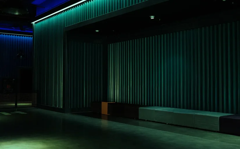 Empty theater space with industrial design and dramatic lighting, ideal for performances