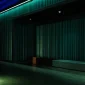 Empty theater space with industrial design and dramatic lighting, ideal for performances