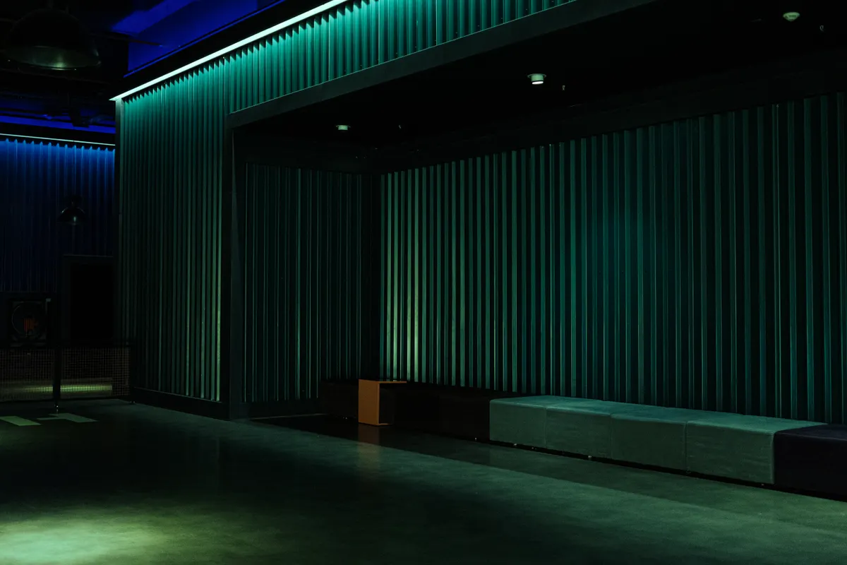 Empty theater space with industrial design and dramatic lighting, ideal for performances